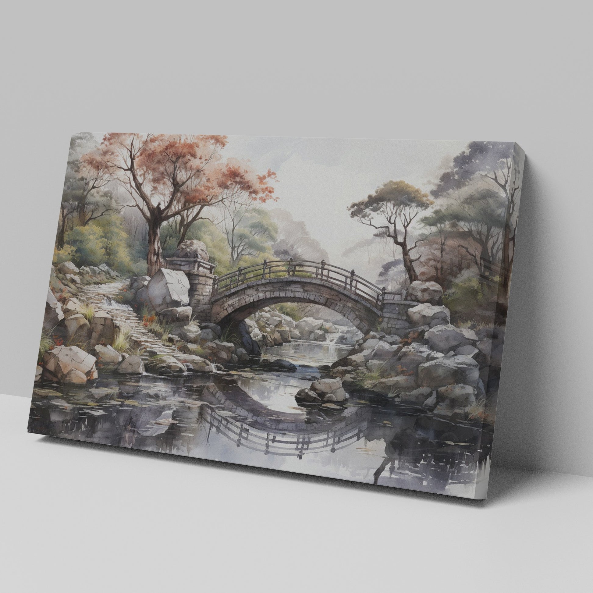 Framed canvas print of an autumnal stone bridge over a serene stream, surrounded by trees with watercolour details