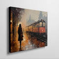 Framed canvas print of an abstract evening train station scene with golden hues and a glowing train