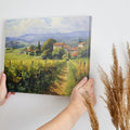 Framed canvas print of Tuscan vineyard and countryside landscape with vibrant colours and rustic farmhouses