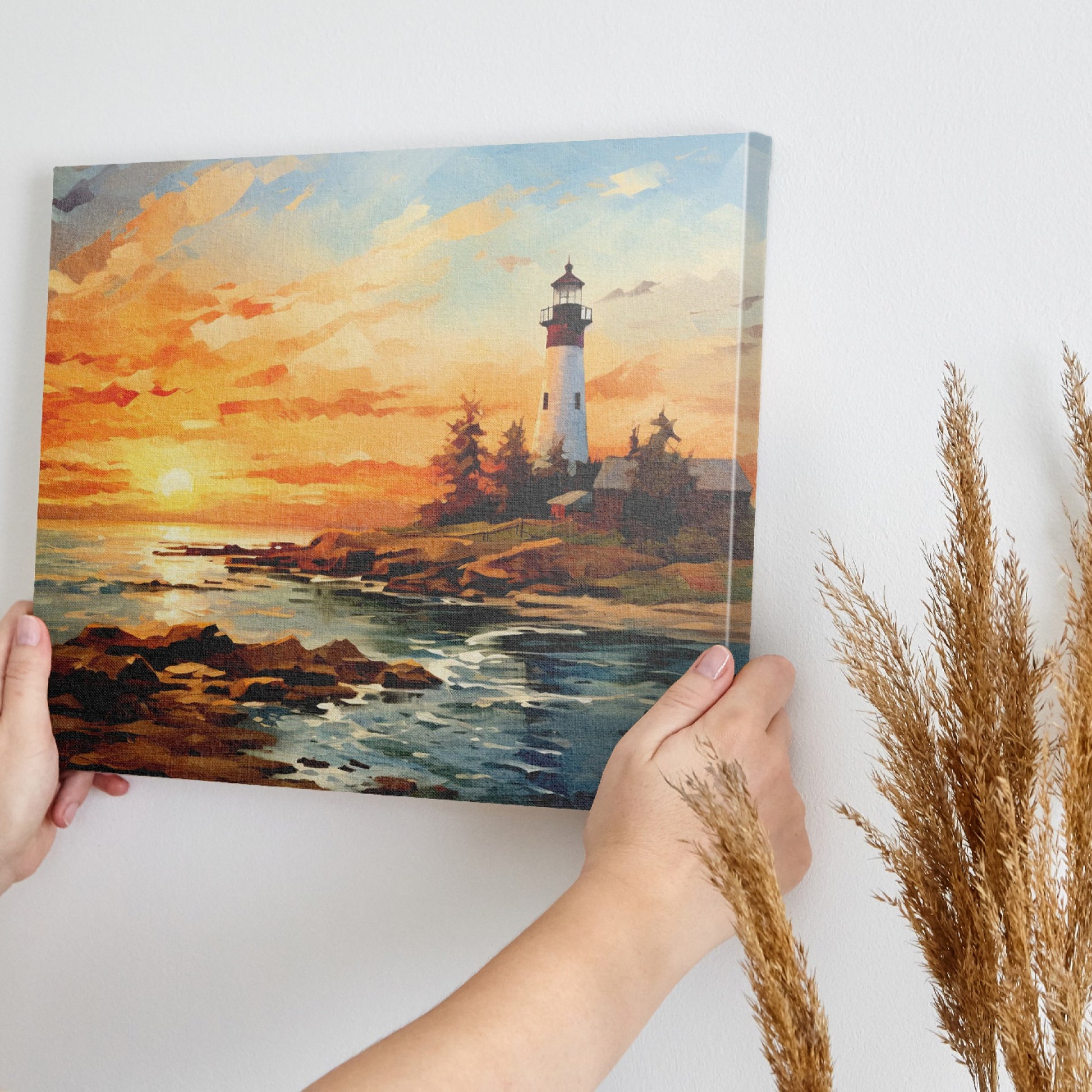 Framed canvas print of a lighthouse overlooking the ocean at sunset with vibrant sky and calm water reflections