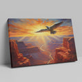 Framed canvas print of a majestic eagle soaring over a stunning canyon at sunset with radiant orange and red hues